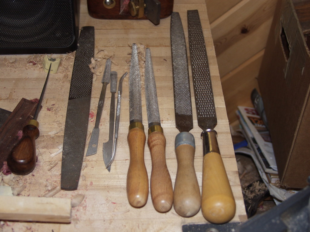 Here's the tools I used. An old Nicholson large 4-in-1, a set of Grammercy riflers, 2 Grammercy rasps, and a couple old Nicholsons, rarely the larger course, mostly the one with the nubbies. I rarely use the 4-in-1 either.